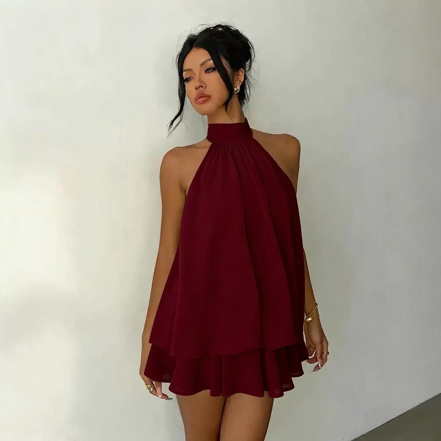 Slim-fit, sexy backless halter top with waist-cinching tie and sleeveless short skirt