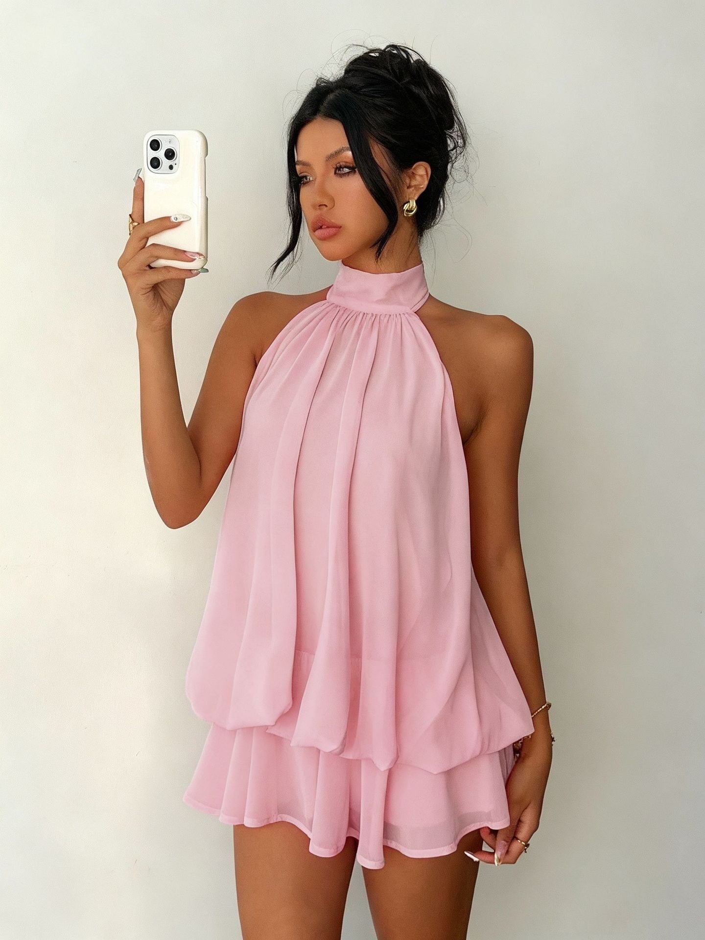 Slim-fit, sexy backless halter top with waist-cinching tie and sleeveless short skirt