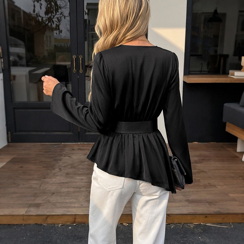 blouse with ruffled hem, solid color, V-neck, and long sleeves